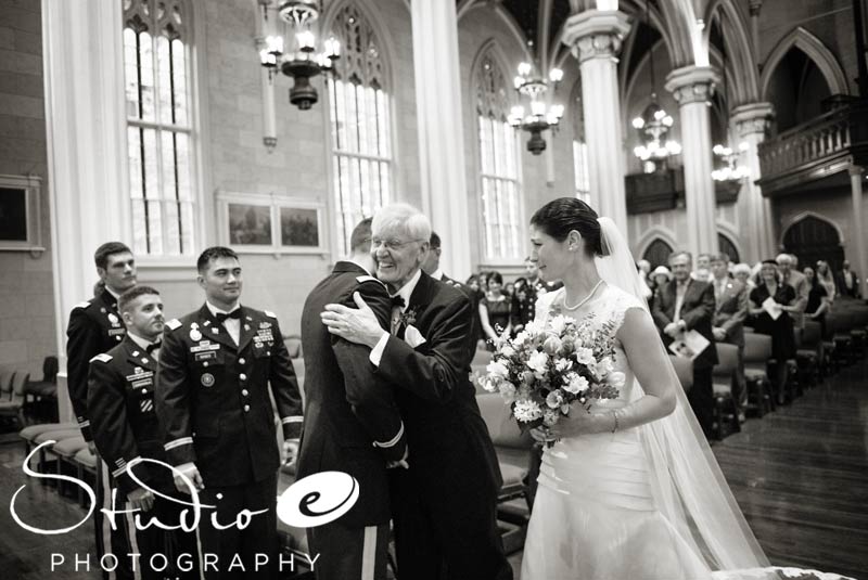 Father gives the bride away at the Cathedral of the Assumption