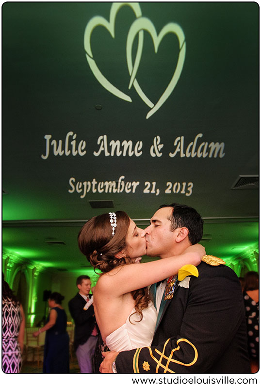 Seelbach Wedding - Bride and Groom kiss beneath DJ lights